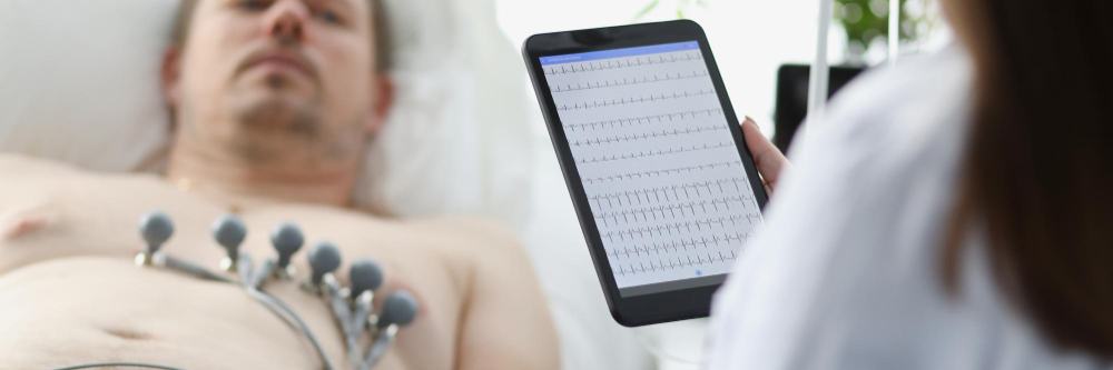 Doctor reviewing heart rhythm data on a tablet